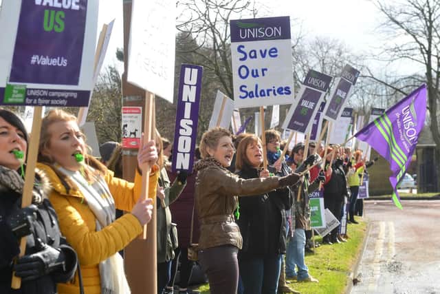 Teachers protest at Durham's County Hall.