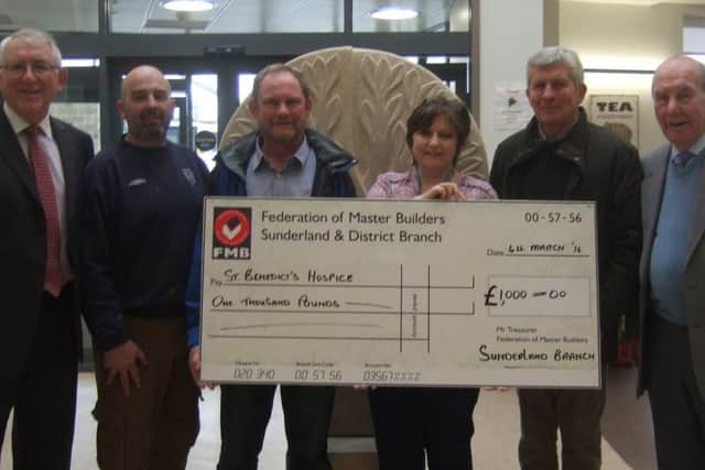Chairman David  Heaton and Members of the Sunderland Branch Federation of Master Builders presented a cheque for Â£1,000 to St Benedict's Hospice.