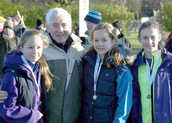 Jim Alder presents medals to the Houghton Harriers under-13 team at the North Eastern Cross Country Championships, back in 2014.