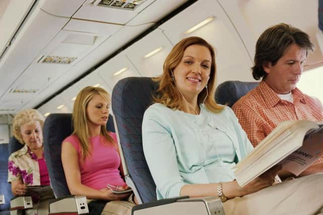 Holidaymakers enjoy their flight. Horrific toilet malfunction not pictured.