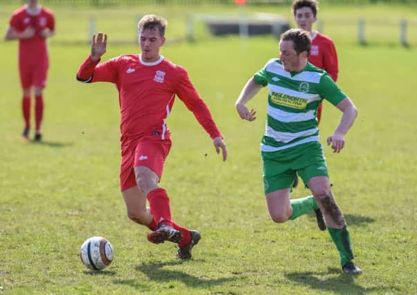 Murton (red) battle against Cleator Moor Celtic in the Wearside League last week. Picture by Kevin Brady