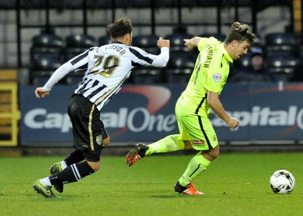 Pools' Michael Duckworth (right) battles against Notts County on his return to action