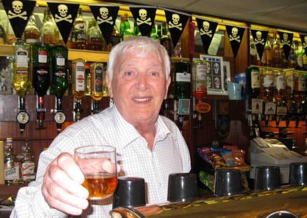 Norman Gray at the bar of Sunderlands Royal British Legion club, where he was chairman for many years.