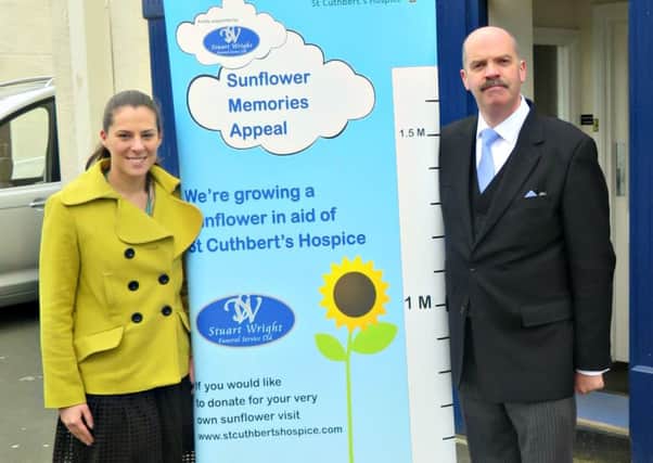 Kay Carrick, Senior Donor Development Fundraiser at St Cuthberts Hospice, and Stuart Wright, of Stuart Wright Funeral Services Ltd, launch the Sunflower Memories Appeal.