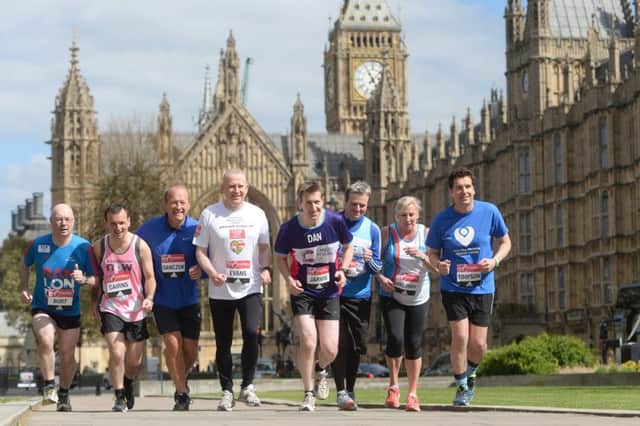 Members of Parliament (from left) Alistair Burt, Alun Cairns, Simon Danczuk, Graham Evans, Dan Jarvis, Jamie Reed, Amanda Solloway and Edward Timpson, outside the Houses of Parliament in central London as they prepare to run in this year's Virgin Money London Marathon. Picture: Press Association.