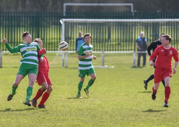 Murton (red) battle against Cleator Moor Celtic a fortnight ago