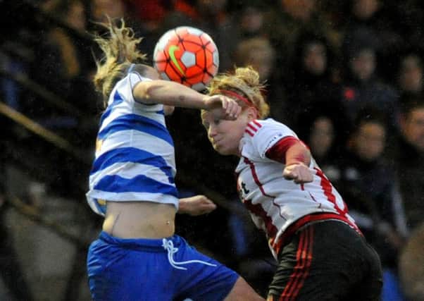 Rachel Furness (right) battles for the ball against Reading Ladies. Picture by Kevin Brady