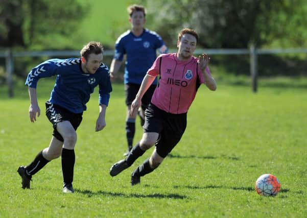 Farringdon ISL (pink shirts) fight it out in their recent derby cup clash with Farringdon Detached