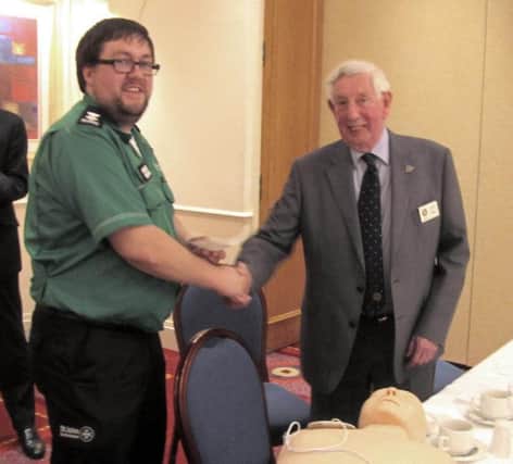 Keith Higgin, of Seaburn Rotary Club presents St John representative with a cheque for Â£1,000.