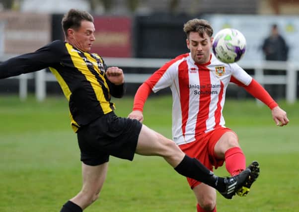 Ryhope CW (red and white) battle in Saturday's defeat at Hebburn Town. Picture by Tim Richardson