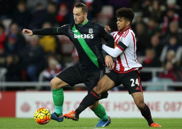 Stoke City's Marko Arnautovic holds off Sunderland's DeAndre Yedlin