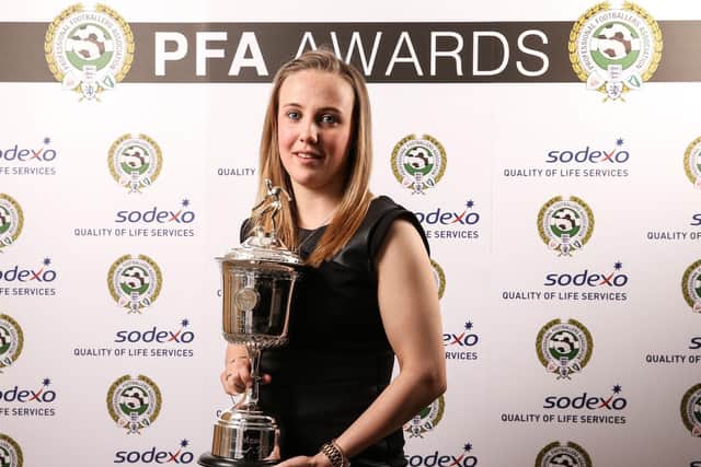 Beth Mead celebrates with her award