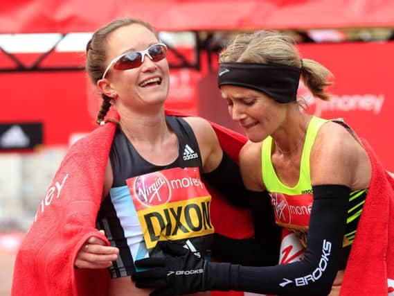 Great Britain's Aly Dixon (left) and Sonia Samuels celebrate after crossing the line during the 2016 Virgin Money London Marathon