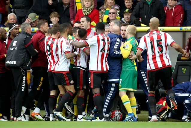 Tempers flare on the touchline after a robust challenge on Sunderland's DeAndre Yedlin during the Barclays Premier League match at Carrow Road, Norwich