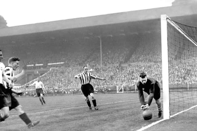 Bobby Gurney shooting at goal during the match.
