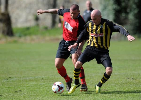 Over 40's football action in the Alan Spedding Cup Final between Dubmire WMC (yellow/black) and Heaton Stannington