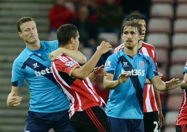 Marc Muniesa (right) looks for calm in Stoke's 2-1 Capital One Cup win at Sunderland last season, the night he netted both goals for the visitors