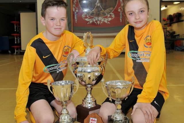 Easington Primary School boy and girl football team captains Luke Marr and Grace Archer.