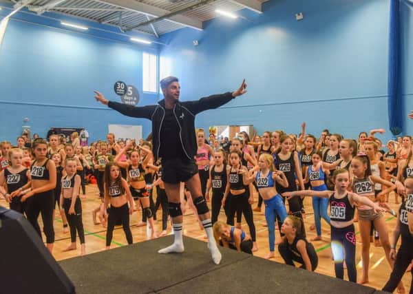 Dance choreographer Robert Hamilton with young hopefuls in a dance scholarship audition at Washington Leisure Centre, on Monday.