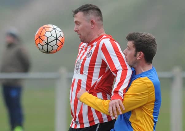 Sunderland West End (red and white) battle for the ball in Saturday's Wearside League win over Whitehaven. Picture by Tim Richardson