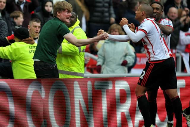 The Sunderland players celebrate with the fans