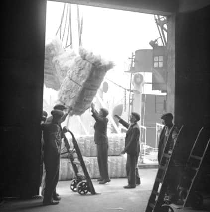 Unloading sisal, which is used to make rope, in March 1949.