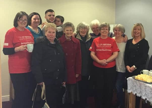 Co-op funeral care staff and the community as they host a coffee morning for charity.