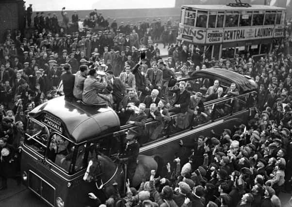 The Sunderland team on an open-topped bus as it heads towards a civic reception.