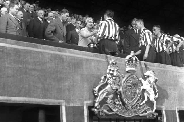 Raich Carter receives the Cup from Queen Elizabeth, followed by Alex Hall, Bobby Gurney and Sandy McNab.