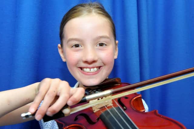 Hart Primary School pupil Cary Stoker playing her Violin . Picture by FRANK REID