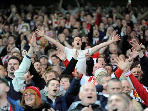 Sunderland fans celebrate the 3-0 win against Everton.