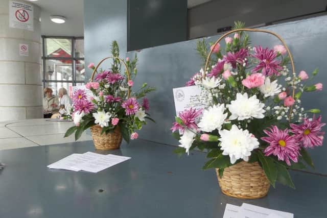 Floral arrangements left in Park Lane bus station by Sunderland Floral Art Club as part of the 'Lonely Bouquet' event.