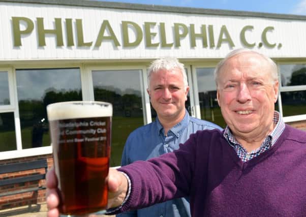 Philadelphia Cricket Club's annual beer festival. Front chairman Malcolm Pratt and bar manager Paul Thompson