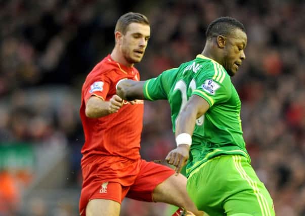 Liverpool's Jordan Henderson tracks Sunderland's Lamine Kone earlier this season