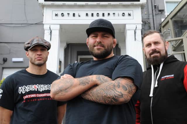 MMA awards promoters Steven France, left, and Dale Percival, right, with nominee James Mulheron, outside the Roker Hotel.