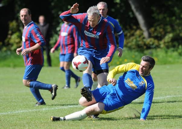 Billy Lorraine Cup Final action between Ivy Legends (blue and red stripes) and New Marske SC, who won 3-1 at Wearmouth CW