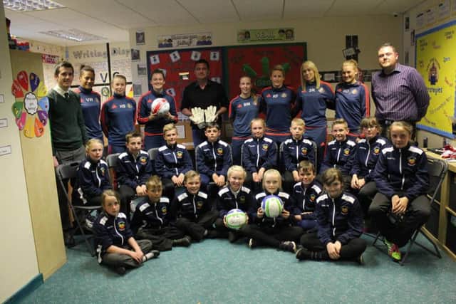 Easington Primary School pupils with Steve Harper and members of SAFC Ladies team.