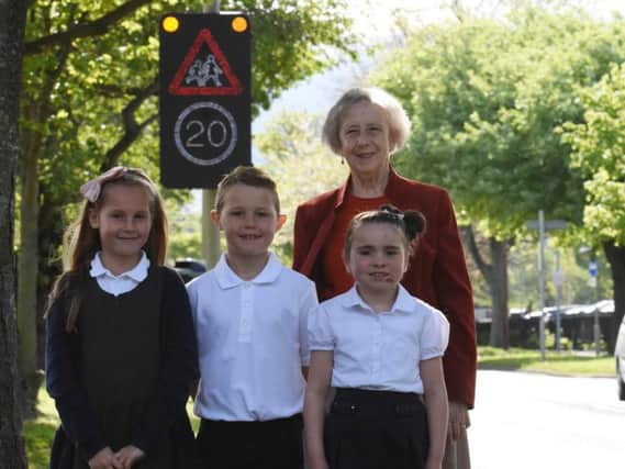 Coun Moira Smith with pupils from Ashley Primary School, from left, Chloe Hayes, Charlie Gray and Amber Henderson, all aged seven.