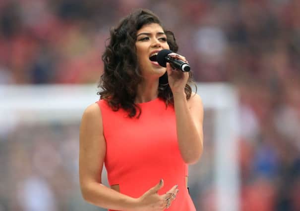 Karen Harding sings the national anthem before the Emirates FA Cup Final at Wembley Stadium. Photo credit: Mike Egerton/PA Wire.