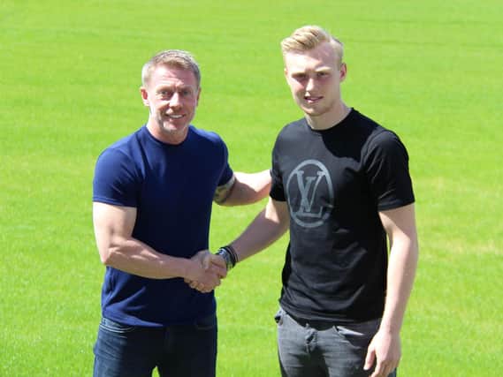 Craig Hignett welcomes Ben Pollock to the club. Picture supplied by Hartlepool United.