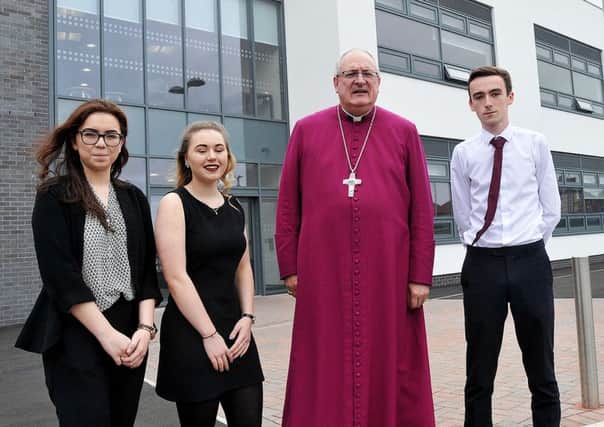 Bishop Stephen Conway is welcomed to Whitburn C of E Academy 6th form college by students (left to right) Chloe Manuel. Chloe Inskip and Chris Williams Photograph by FRANK REID