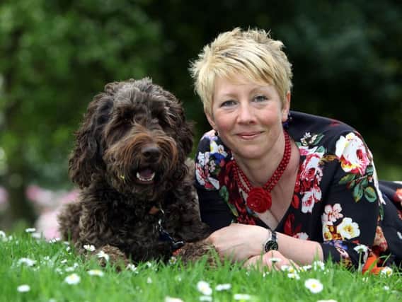 Dr Catherine Douglas, of Newcastle University, with her labradoodle Mumford which was sourced from a responsible breeder. Picture by Dave Charlton/PA Wire
