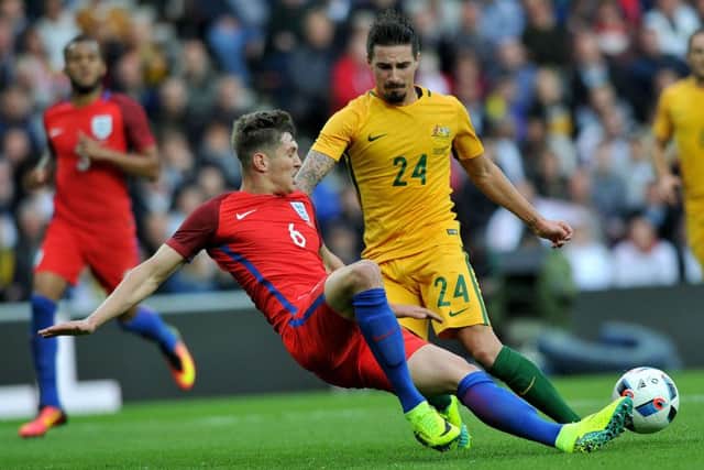 England defender John Stones dives in for a challenge last night. Picture by Frank Reid