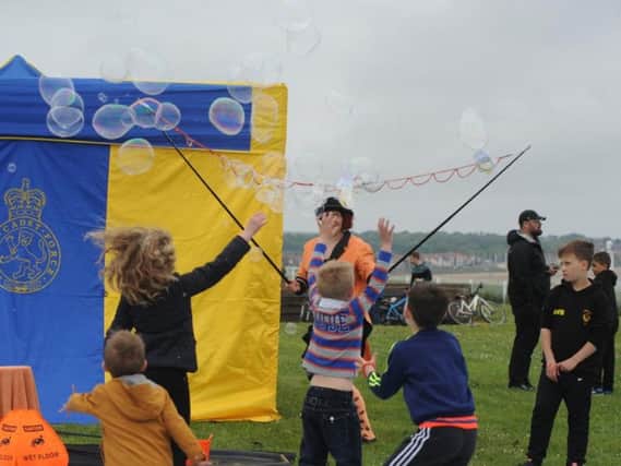 Sunderland Live's Best of British family fun day held at Bede's Cross, Roker - youngsters burst bubbles from Bubble Inc.