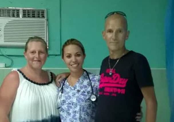 Keith and wife Sharon with Dr Yohana, one of the Cuban doctors who saved his life