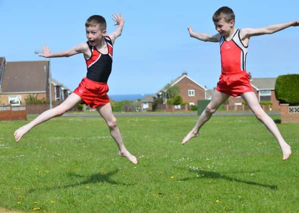 Gymnastic big achieving premature twins.
From left Matthew and David Smith aged 9