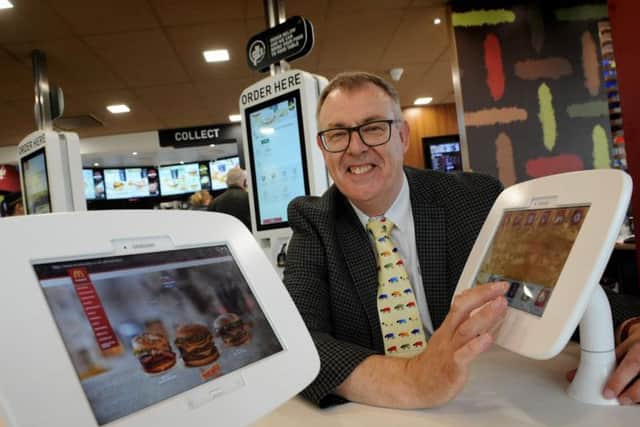 Jasper Maudsley with some of the new technology at the Dalton Park McDonald's store.