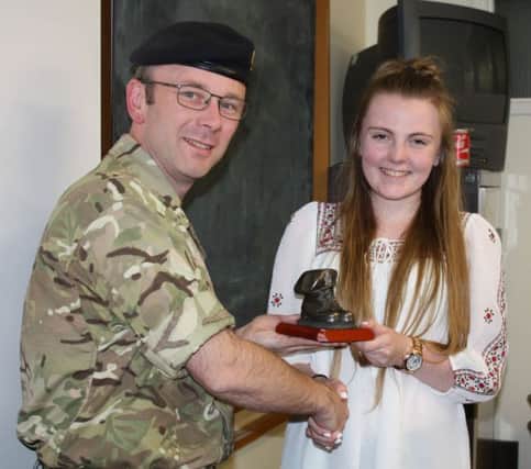 Major Paul Thornley makes a presentation to Cadet Regimental Sergeant Major Becky Dewhurst on her last night as an Army Cadet with Seaburn (Martin Leake VC) Detachment, A Company, Durham ACF.