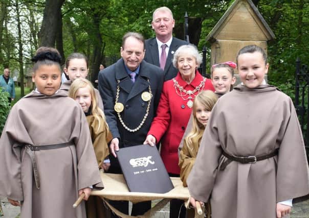 The Mayor and Mayoress of South Tyneside, Coun Alan and Moira Smith, and Coun John Kelly, Lead Member for Public Health, Wellness and Culture, with children in monks robes carrying the Childrens Codex.