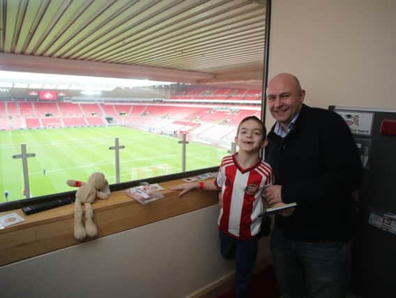 Nathan Shippey with his father Peter in the sensory room at the Stadium of Light
